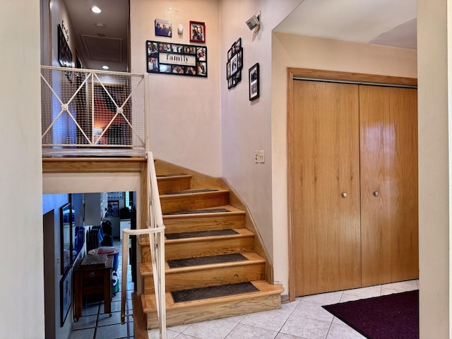 stairs with tile patterned flooring