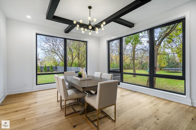 dining space featuring an inviting chandelier, plenty of natural light, light hardwood / wood-style flooring, and beamed ceiling