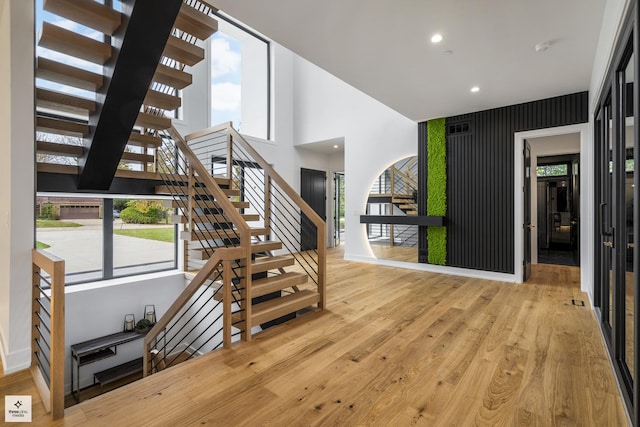 stairway featuring wood-type flooring