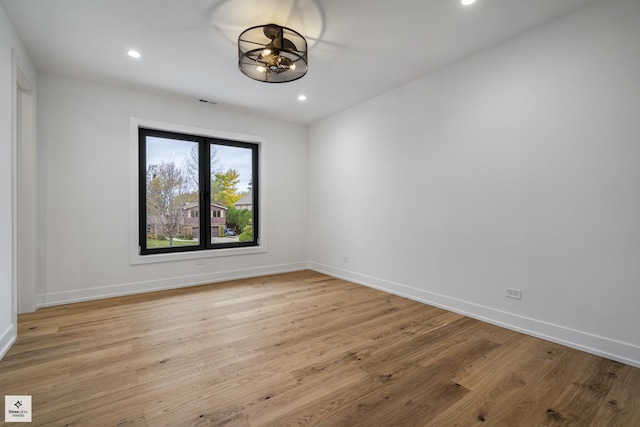 unfurnished room featuring light hardwood / wood-style floors