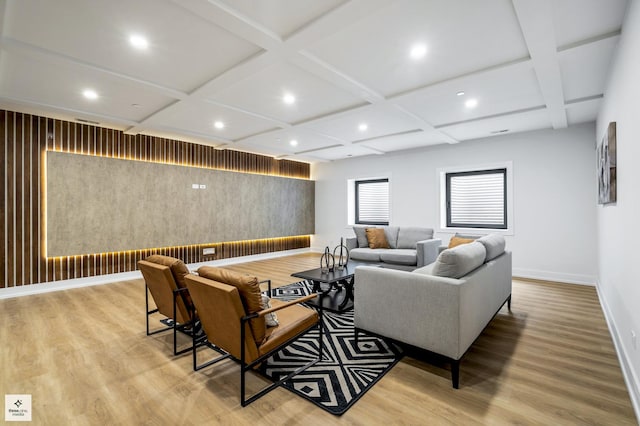 living room with light hardwood / wood-style floors and coffered ceiling