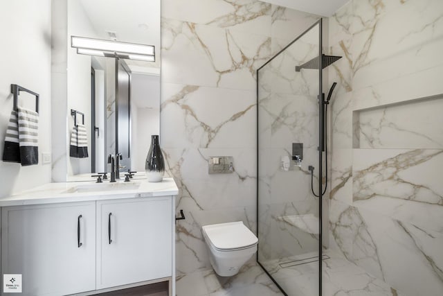 bathroom with vanity, toilet, and tiled shower