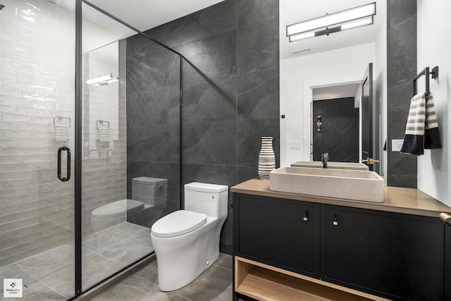 bathroom featuring toilet, tile walls, walk in shower, and vanity