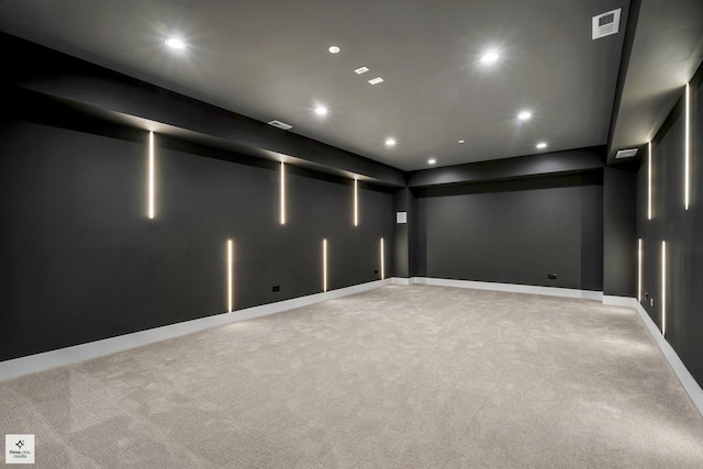 cinema room with light colored carpet