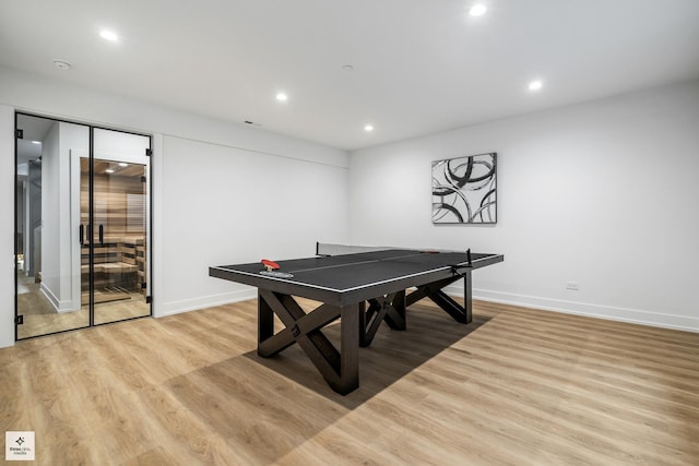 recreation room featuring light hardwood / wood-style flooring