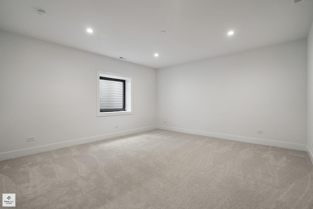 empty room featuring light colored carpet