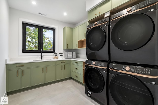 clothes washing area featuring cabinets, stacked washer and clothes dryer, separate washer and dryer, and sink