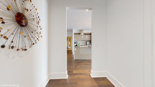 hallway with dark hardwood / wood-style floors