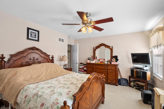 carpeted bedroom with ceiling fan