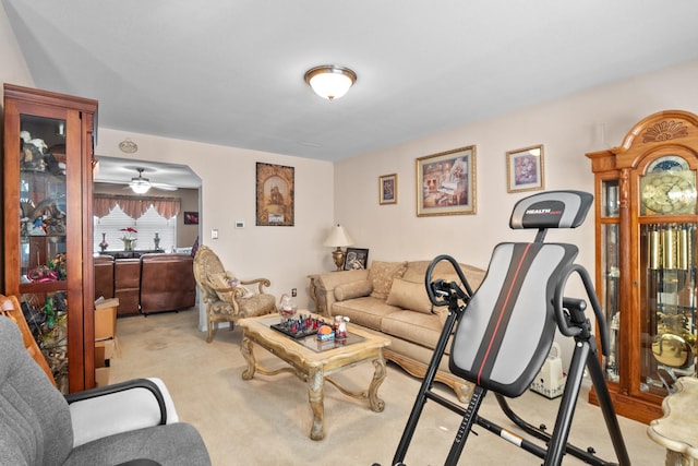 living room featuring ceiling fan and light carpet