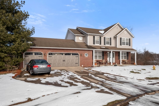 view of front of home with a garage and a porch