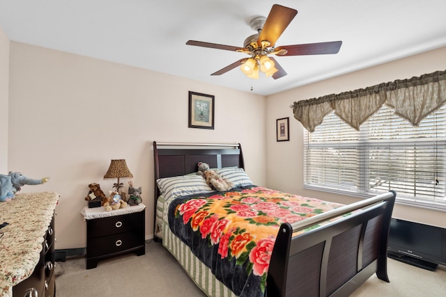 bedroom featuring ceiling fan and light colored carpet