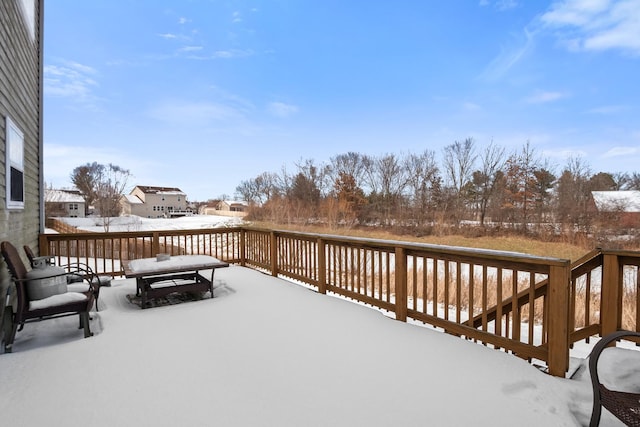 view of snow covered deck