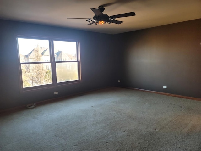 carpeted empty room with ceiling fan