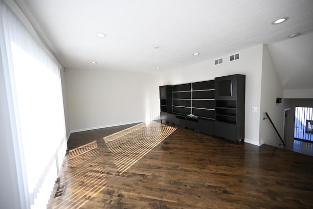 unfurnished room featuring dark wood-type flooring