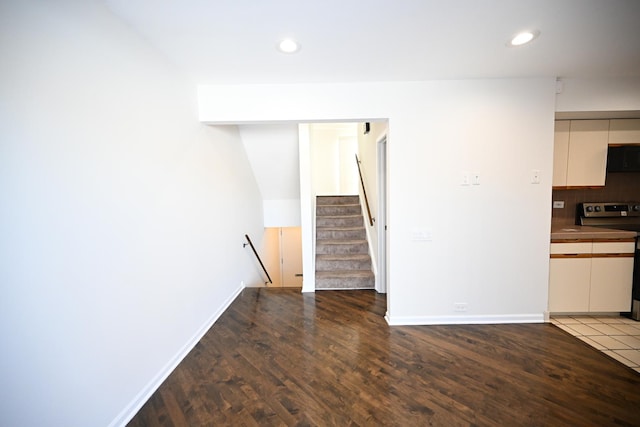 unfurnished living room with hardwood / wood-style flooring