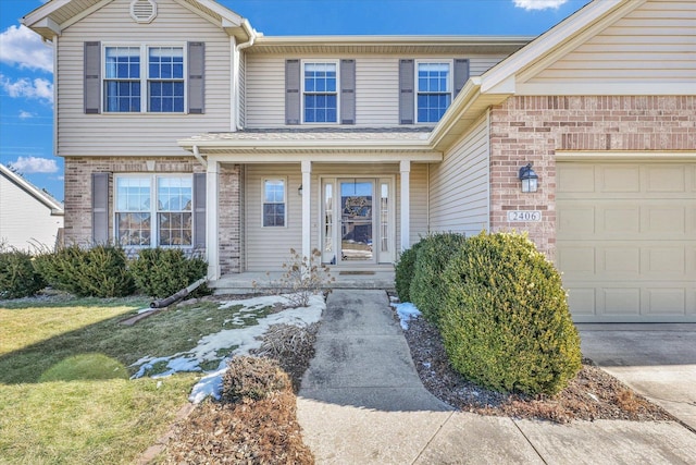 view of front of home with a garage and a front yard