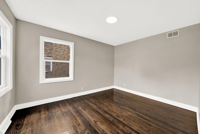 unfurnished room featuring wood-type flooring