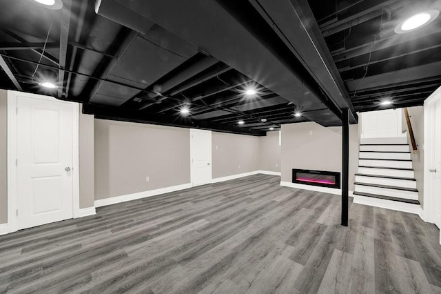 basement featuring hardwood / wood-style flooring