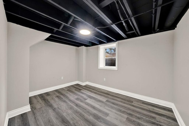 basement with hardwood / wood-style floors