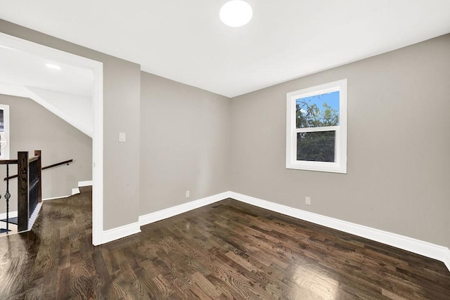 unfurnished room featuring dark hardwood / wood-style flooring