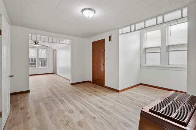 spare room featuring ceiling fan and light wood-type flooring