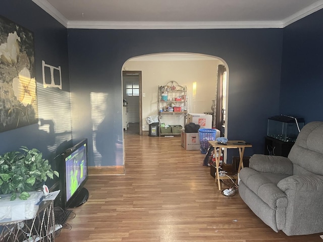 living room featuring crown molding and hardwood / wood-style floors