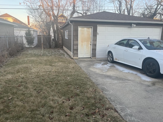 garage featuring a lawn