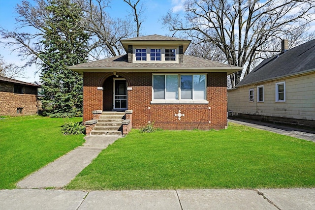 bungalow-style home featuring a front lawn