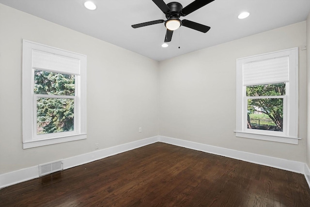 spare room with ceiling fan and hardwood / wood-style flooring