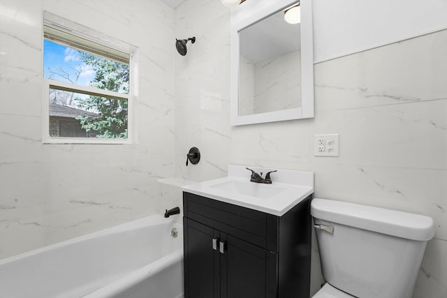 full bathroom with toilet, tiled shower / bath, and vanity