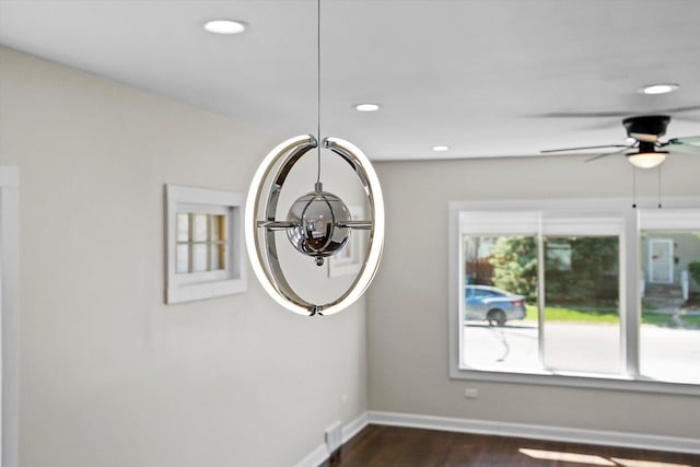 room details with ceiling fan and hardwood / wood-style floors