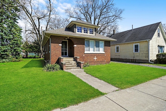 bungalow-style home with a front yard