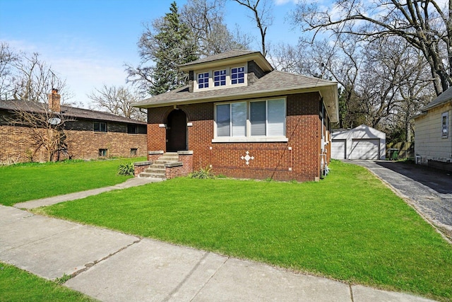 bungalow with a garage, a front yard, and an outdoor structure