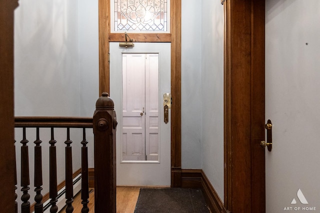 interior space featuring light wood-style flooring and baseboards