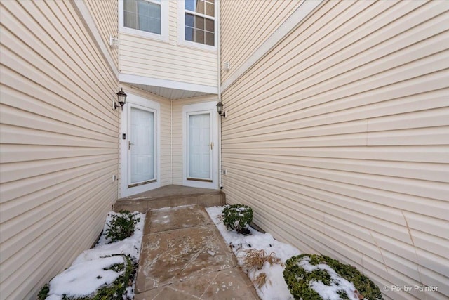 view of snow covered property entrance