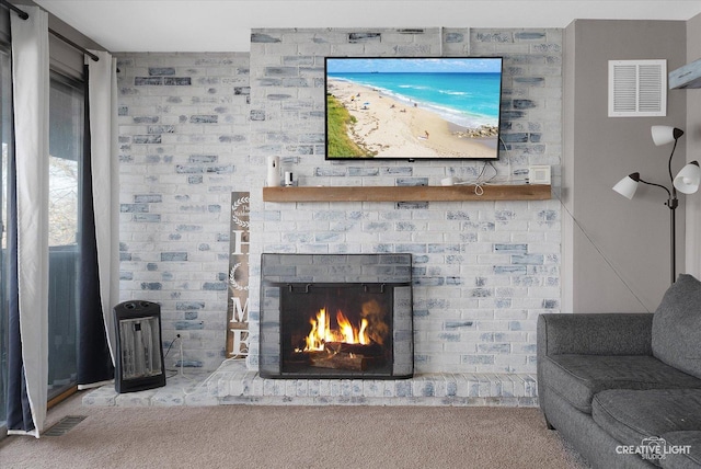 interior details with a fireplace and carpet flooring