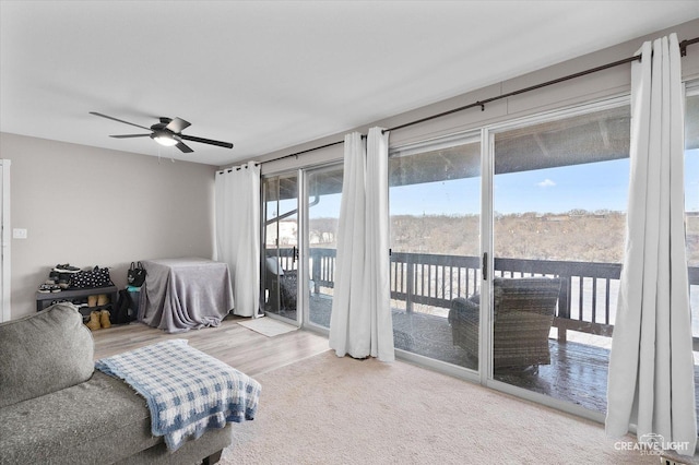 bedroom featuring ceiling fan, access to exterior, and hardwood / wood-style flooring