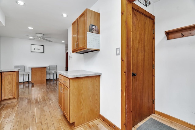 kitchen featuring light wood-type flooring and ceiling fan