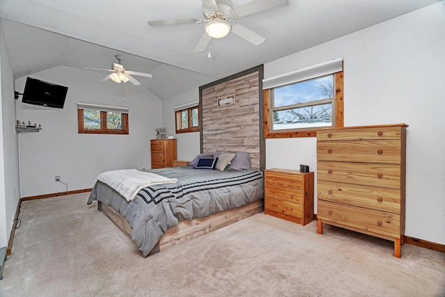 carpeted bedroom with lofted ceiling and ceiling fan