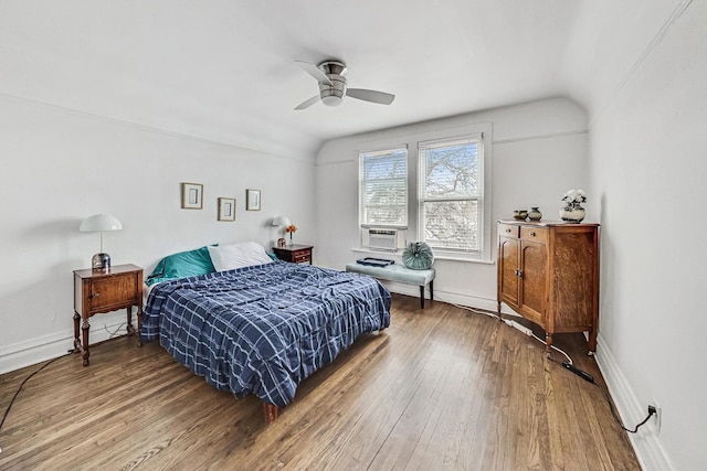 bedroom featuring ceiling fan, cooling unit, wood-type flooring, and lofted ceiling