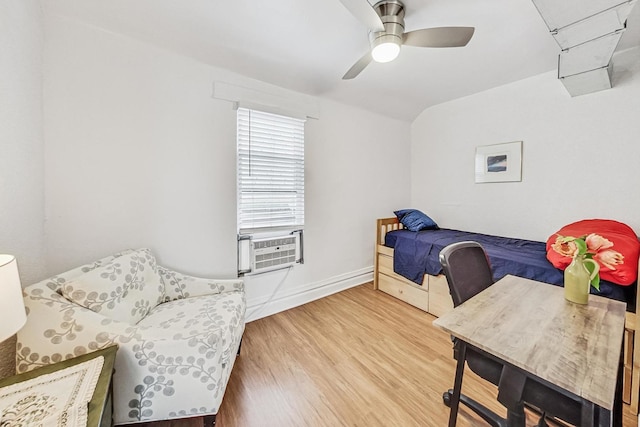 bedroom with ceiling fan and hardwood / wood-style flooring