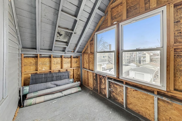 sunroom featuring vaulted ceiling