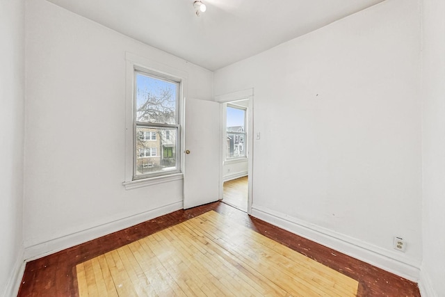 spare room featuring hardwood / wood-style flooring