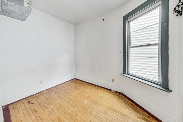 unfurnished room with hardwood / wood-style flooring