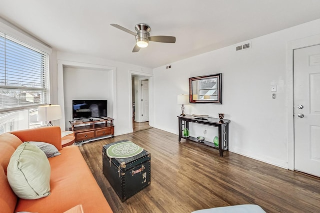 living room with hardwood / wood-style flooring and ceiling fan