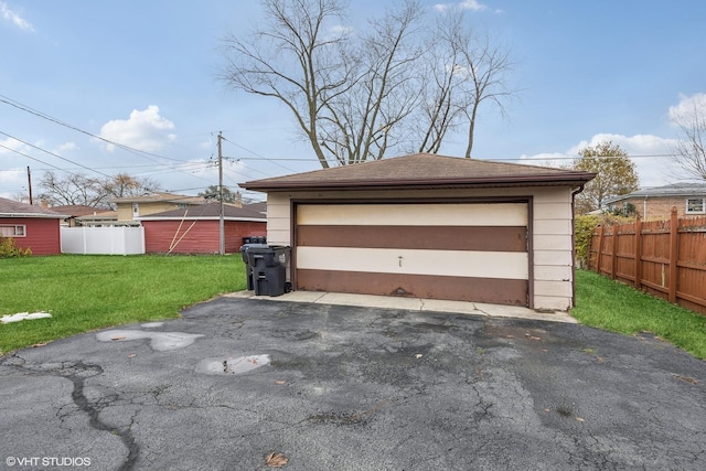 garage featuring a lawn