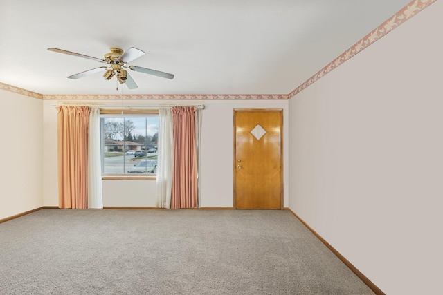 unfurnished room with ceiling fan and carpet floors