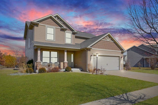 craftsman inspired home featuring concrete driveway, stone siding, an attached garage, covered porch, and a yard