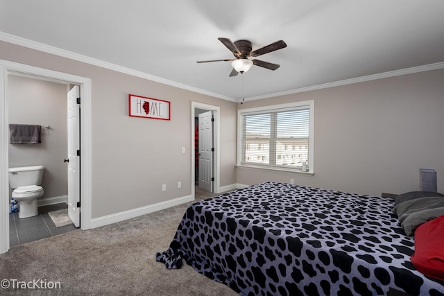 carpeted bedroom with ceiling fan, a closet, ensuite bathroom, and ornamental molding